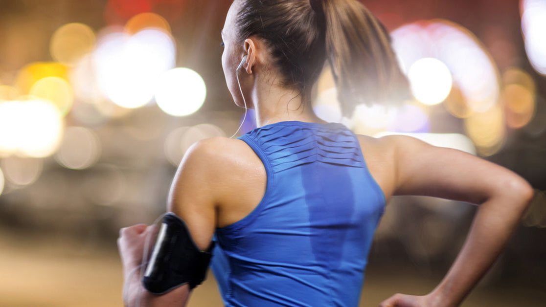 Female runner with sweat on her back